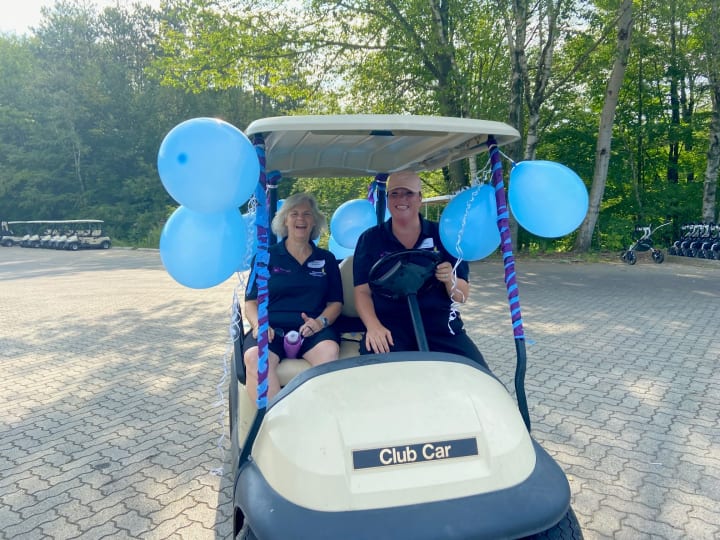 Smiles and golf carts at golf fundraiser for hospice