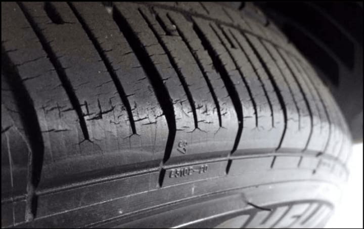 a tire with visible cracks from dry rotting