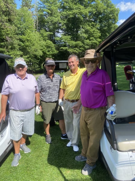 Golfers with their carts