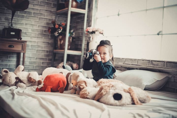 girl playing with camera