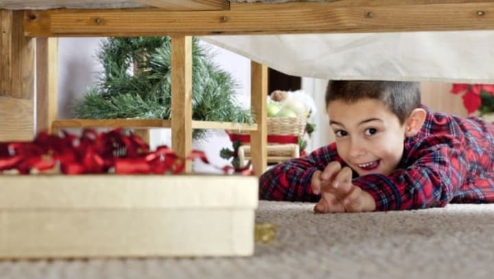 Boy trying to find Christmas presents at Apple Self Storage