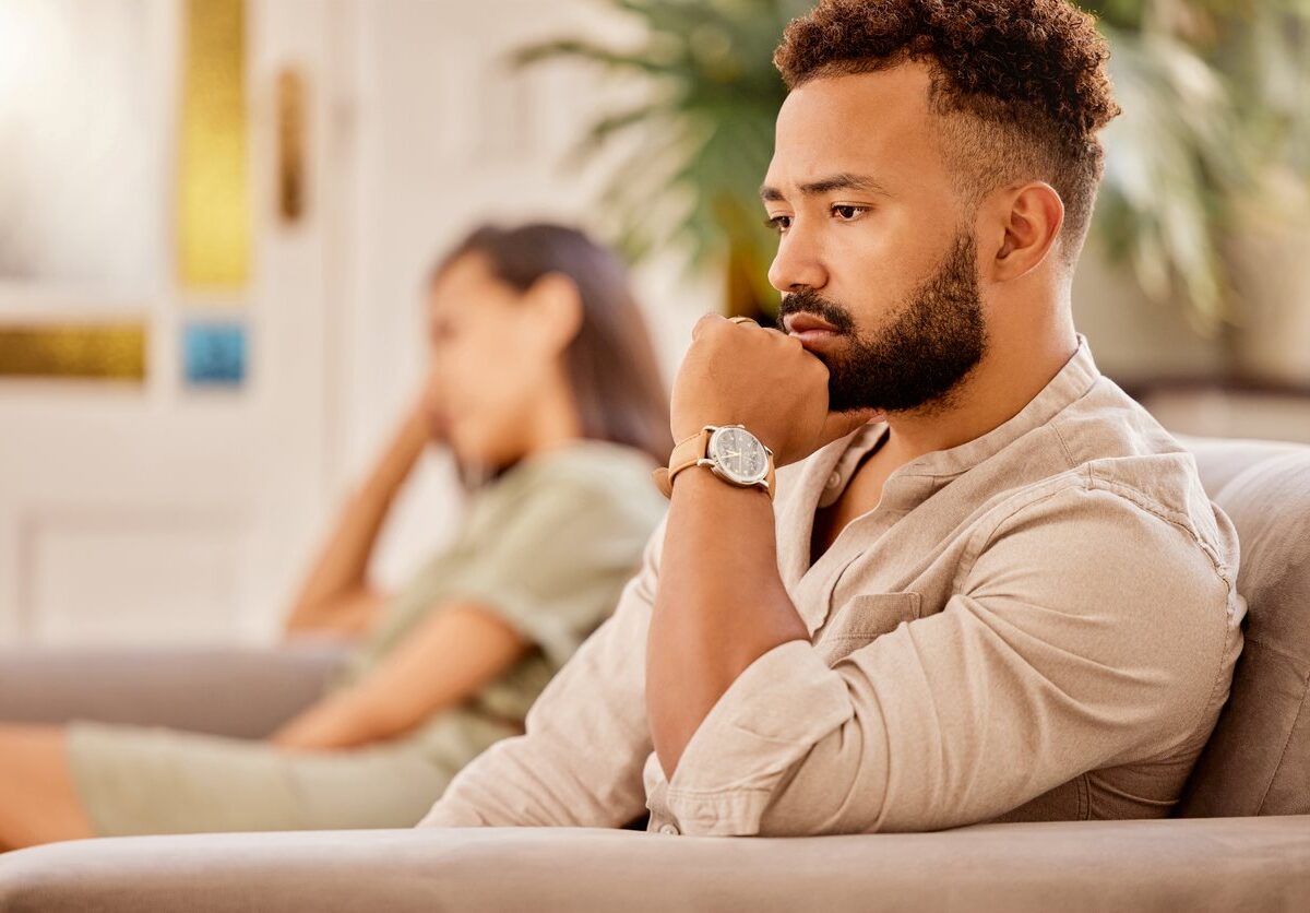 A man and woman sitting next to each other.