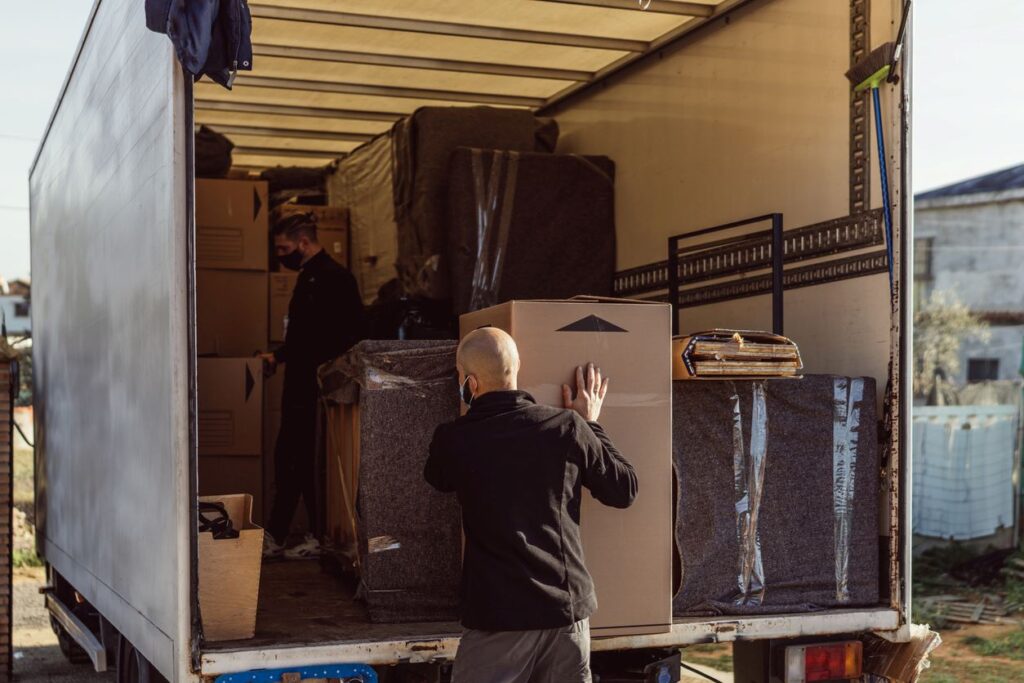 A man loads his things into his moving truck before heading to his storage unit.